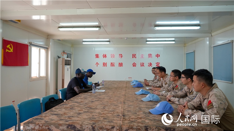 圖1 檢查組聽取工作匯報。王軍杰攝